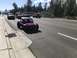 1970 Volkswagen Beetle - A custom purple dune buggy is seen on the road, distinct from the other vehicles in the background.