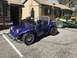 1970 Volkswagen Beetle - A custom purple dune buggy is parked in front of a building, with another buggy visible behind it.