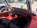 1970 Volkswagen Beetle - Dune buggy interior with custom dashboard and racing seats, parked next to another vehicle.