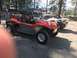 1970 Volkswagen Beetle - Two custom vehicles are parked outdoors on a sunny day.