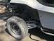1970 Volkswagen Beetle - A white dune buggy is shown from the side, aggressive off-road tires and visible engine parts.