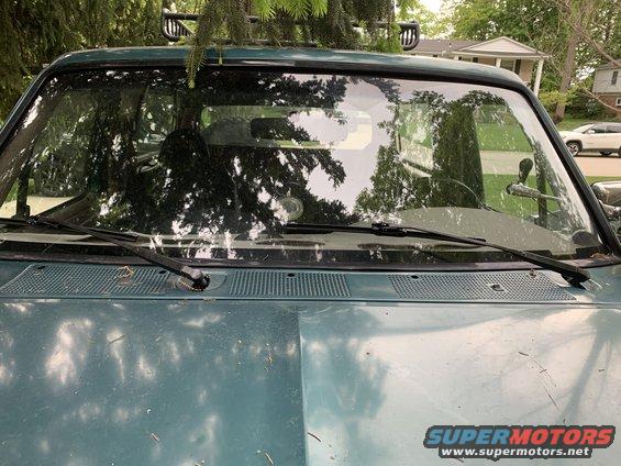 Green 1996 Ford Bronco windshield and hood with roof rack