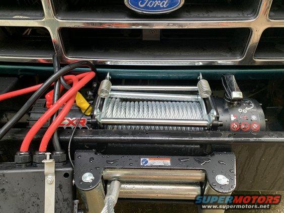 1996 Ford Bronco front grille with a winch mounted below, red and black cables visible
