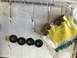 1994 Ford Bronco - Metal bushings and washers are laid out on a cardboard box, with some parts in plastic packaging.