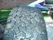 1984 Ford Bronco - Close-up of a tire's tread pattern, with the Supermotors.net logo visible in the lower right corner.