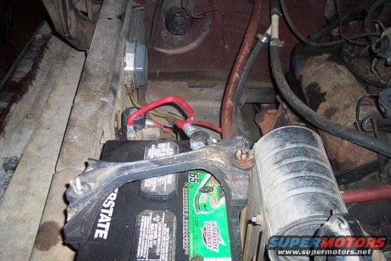 Battery and engine components in a vehicle's engine bay