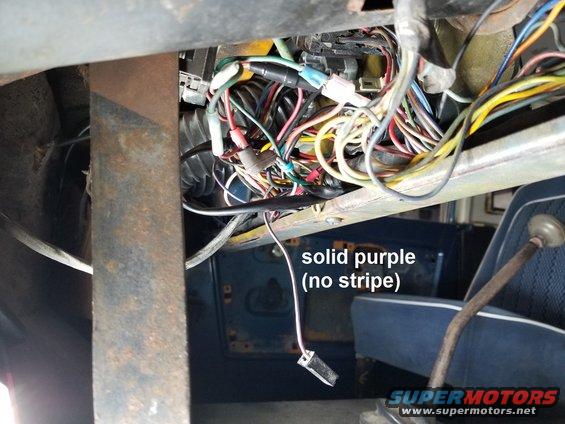 This purple/violet wire should be on the ignition switch, but its only purpose is to test the BRAKE warning bulb (which isn't working, and neither are the brakes at the moment).

UPDATE: the brakes have been fully repaired.