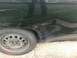 2008 Ford Focus - This dark green vehicle shows extensive damage to its rear quarter panel and a flat tire.