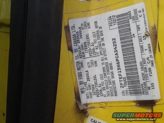 Yellow vehicle door sticker with manufacturing date 11/92