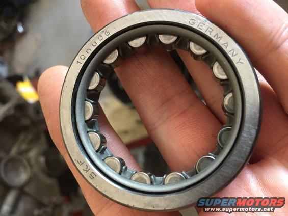 Ball bearing with SKF and GERMANY markings, held by fingers