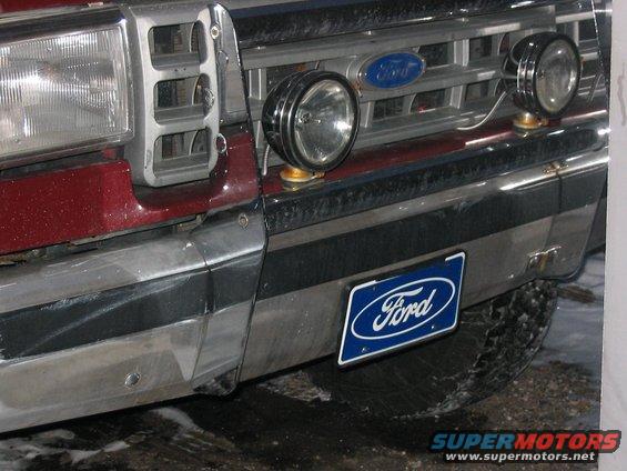 105_0513.jpg Front Blue Ford Plate and KC Daylighters on the Factory Chrome Bull Bumper