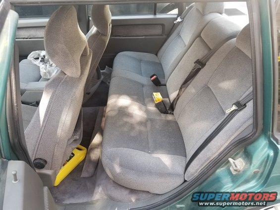 Green Volvo 940 interior rear seats and door panel