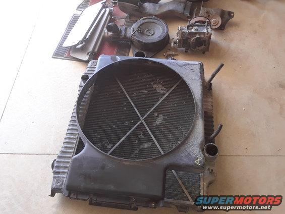 Radiator assembly and other engine components laid out on the floor