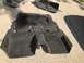 2015 Ford Explorer - Car carpet and trim pieces removed from a vehicle and laid out on concrete for cleaning or replacement.
