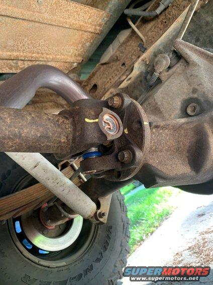 Close-up of the rear differential and driveshaft connection on a vehicle