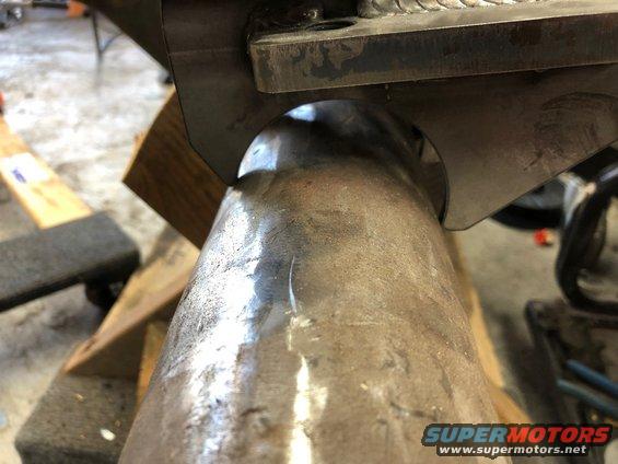 Close-up of a welded metal suspension component, possibly part of a Jeep Wrangler