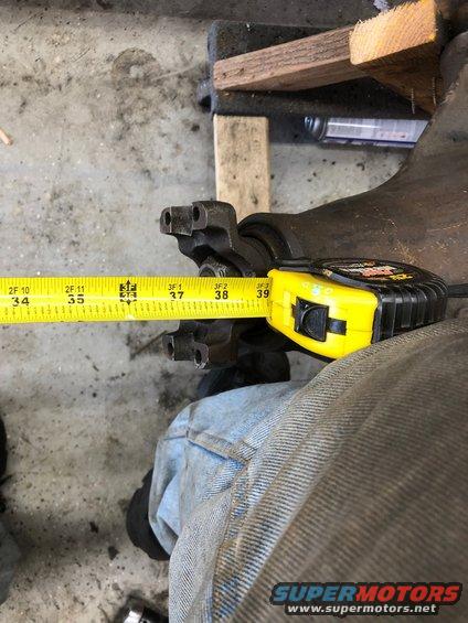Differential housing with a yellow measuring tape showing 37 inches