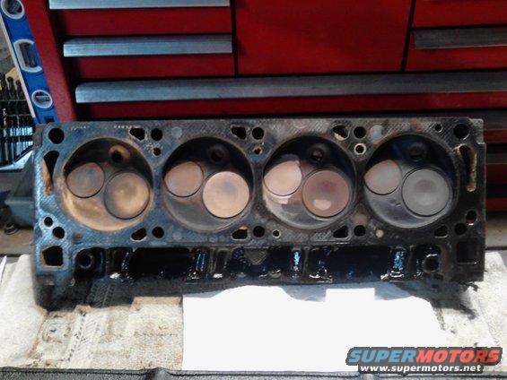 Engine cylinder head with four sets of valves visible