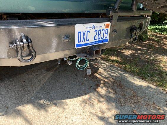 Rear bumper with tow hitch, DXC 2839 Michigan license plate, and tow wiring