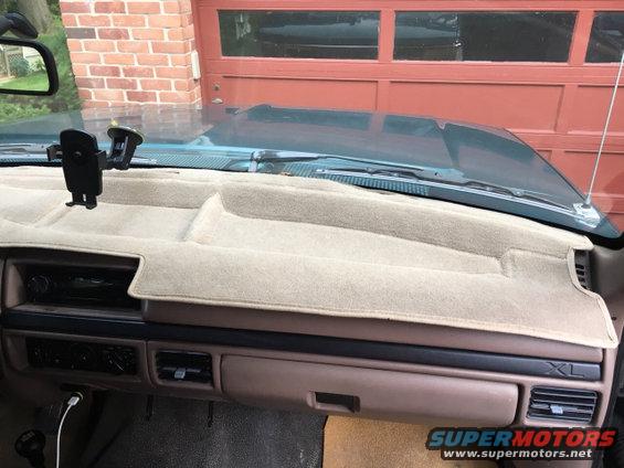 Tan dashboard with XL badge on the right side