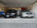 2003 Mercury Marauder - Two Mercury Marauders are parked side-by-side in a garage, displaying their front ends.