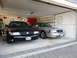 2003 Mercury Marauder - Two Mercury Marauders, one black and one silver, are parked side-by-side in a garage.