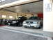 2003 Mercury Marauder - Two 2003 Mercury Marauders are parked in a garage, one silver and one black.