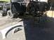 1989 Ford Bronco - Disassembled black Ford Bronco, likely from the late 1980s, undergoing repairs or modification.