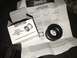 1989 Ford Bronco - Seals-It economy axle seal and its installation guide are laid out on a surface.