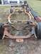 1961 Ford Starliner - This heavily rusted vehicle frame sits outdoors on a grassy area, awaiting restoration or parts.