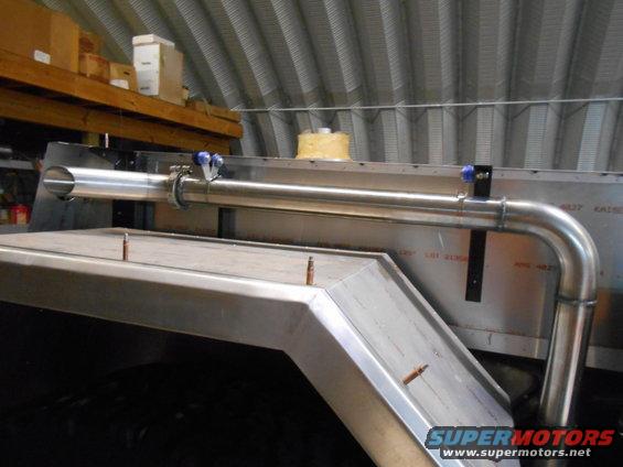 Custom exhaust pipe and fender flare on a vehicle