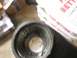 1989 Ford Bronco - A metal component is shown next to a container with visible text.