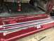 1994 Ford Bronco - The tailgate of a 1994 Ford Bronco is open, revealing new weather stripping and a drill.