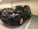 2015 Ford Explorer - A black Ford Explorer Interceptor is parked in a garage, with another vehicle partially visible to its left.