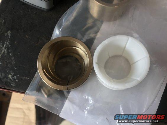 bronze and white plastic bushings for a vehicle suspension