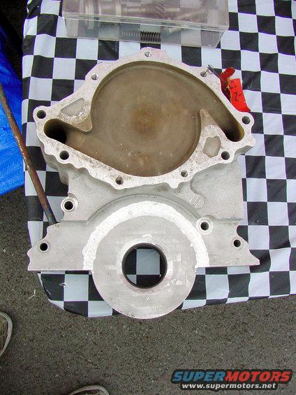 Aluminum engine water pump housing with a circular opening and a spiral internal passage