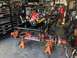 1992 Jeep Wrangler - Jeep chassis and engine assembly on stands in a workshop. SuperMotors logo in corner.