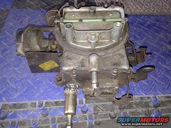 Used carburetor with yellow sticker and Supermotors.net logo