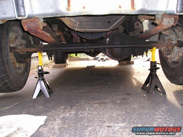 1978 Ford F-250 undercarriage on jack stands, showing front axle and differential