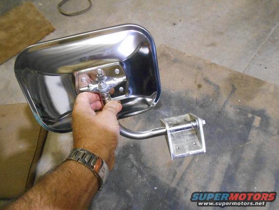 Chrome side mirror assembly held by hand