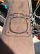 1992 Jeep Wrangler - A hand-drawn template for a gasket is visible on a piece of rusty metal, with a website logo in the corner.