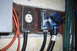 1995 Ford Bronco - Electrical outlets and plugs with attached cables are mounted on a wooden surface.