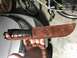 2008 Ford Focus - A leather sheath for a combat knife is shown, USMC markings and an emblem.