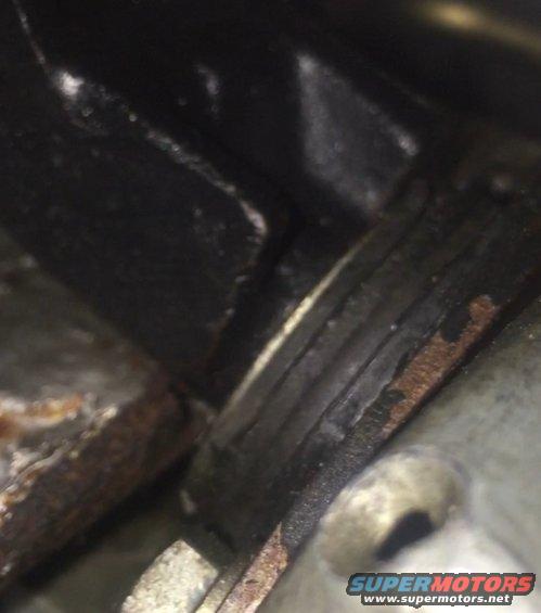 close-up of engine part showing rust and wear