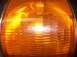 1988 Ford Bronco - This close-up shows the textured lens of an orange turn signal, a common automotive part.