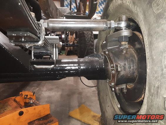 close-up of rear axle, leaf springs, and shock absorber assembly