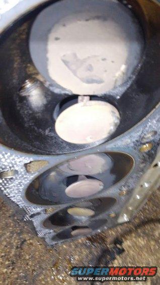7 of 8 exhaust valves hit the pistons and bent leaving them stuck open. not sure why larger intake valves were ok