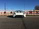 2015 Subaru Impreza - White convertible sports car with black accents parked on asphalt road.