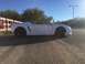 2015 Subaru Impreza - Side view of a white convertible sports car with black wheels.