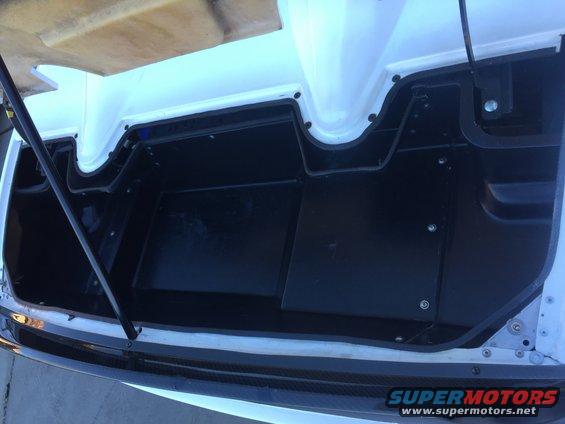 Trunk interior with black lining and white fiberglass structure